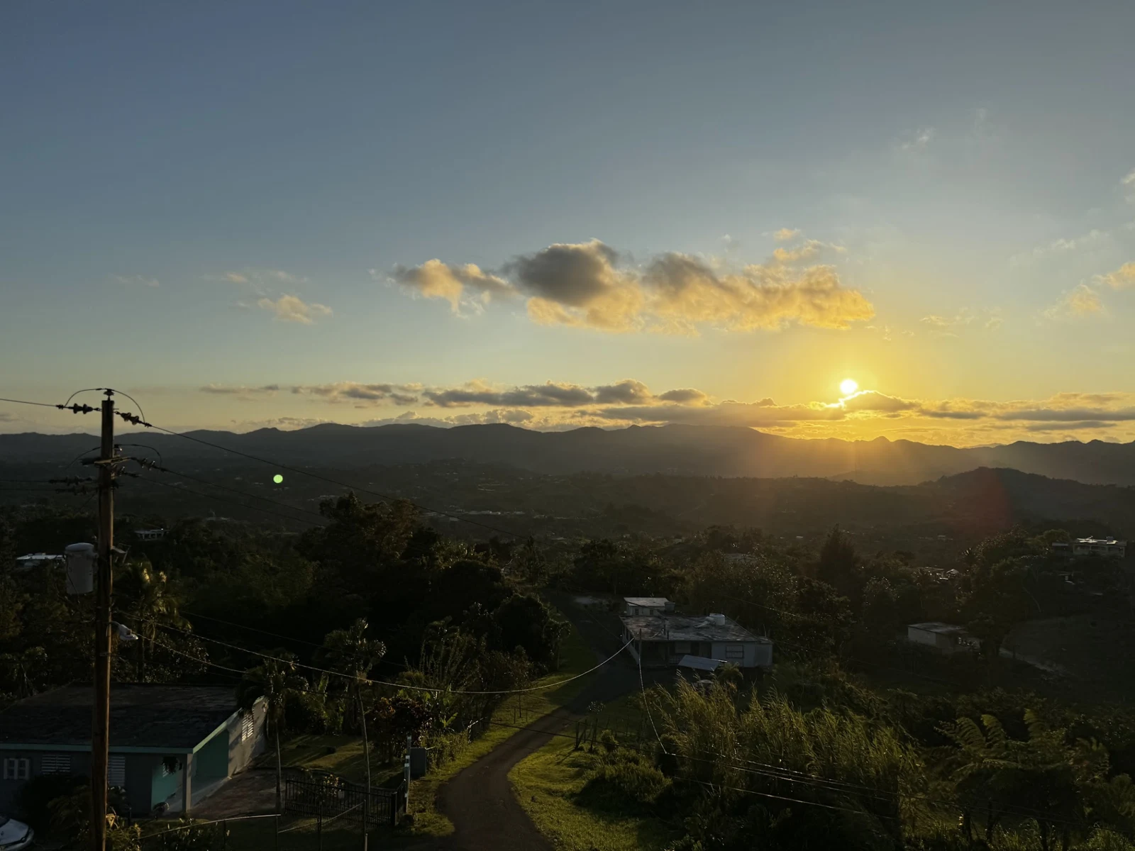 Sunrise over the mountains and homes of Puerto Rico